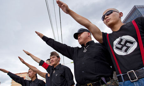 Mongolian neo-Nazi group Tsagaan Khas (‘White Swastika’) give the fascist salute on the streets of the capital Ulan Bator. [Chinanews.cn]