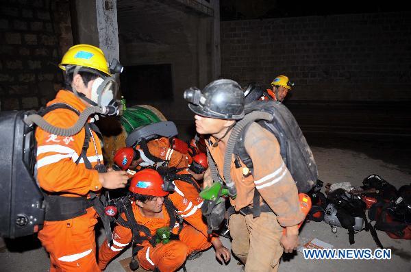 Rescuers prepare at the site of fire in Zhaoyuan, Yantai City, east China's Shandong Province, Aug. 7, 2010. A fire broke out at the Luoshan Gold Mine run by Lingnan Mining Co. Ltd. in Zhaoyuan, east China's Shandong Province, at about 5 p.m. Friday. [Xinhua]