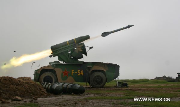 Photo taken on Aug. 7, 2010 shows an antiaircraft missile being fired in the military exercise coded 'Vanguard-2010' in east China's Shandong Province. The five-day long air defense military exercise, the largest-scaled of its kind with over 12 thousand troops mobilized, comes to an end on Saturday. [Ji Liangyan/Xinhua]