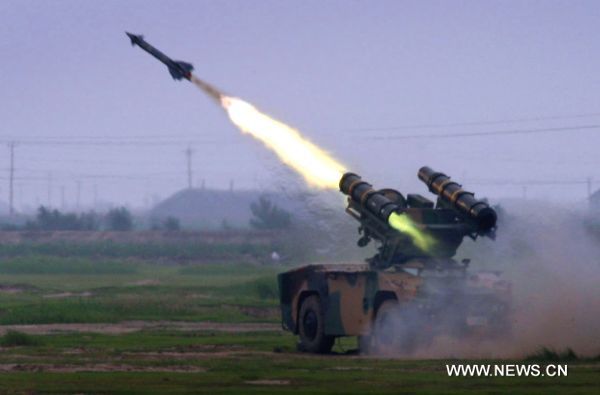 Photo taken on Aug. 7, 2010 shows an antiaircraft missile being fired in the military exercise coded 'Vanguard-2010' in east China's Shandong Province. The five-day long air defense military exercise, the largest-scaled of its kind with over 12 thousand troops mobilized, comes to an end on Saturday. [Ji Liangyan/Xinhua]