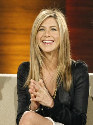 Actress Jennifer Aniston reacts during the television show 'Wetten Dass..?' (Bet it..?) in the western German city of Duesseldorf Feb. 28, 2009. [Xinhua/Reuters]