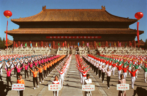 Local residents perform radio gymnastic exercises at a civilian sports meeting in Beijing in this file photo taken in 1997. [Xinhua] 