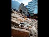 A broken electric brake lies in the ruins, Aug 10, 2010. [Xinhua]