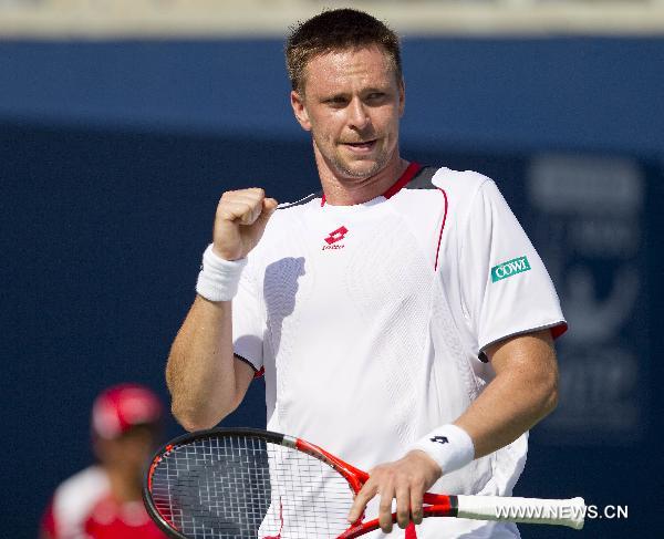 Robin Soderling of Sweden celebrates after scoring against Ernests Gulbis of Latvia during the Rogers Cup in Toronto, Canada, on August 10, 2010. [Xinhua]