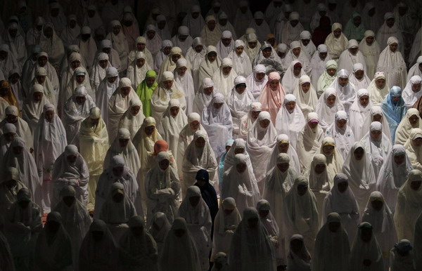 Muslims attend prayers marking the start of Ramadan