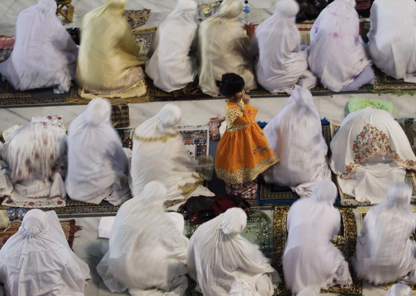 Muslims attend prayers marking the start of Ramadan