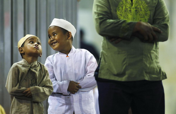 Muslims attend prayers marking the start of Ramadan