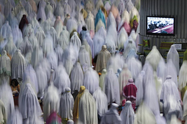 Muslims attend prayers marking the start of Ramadan