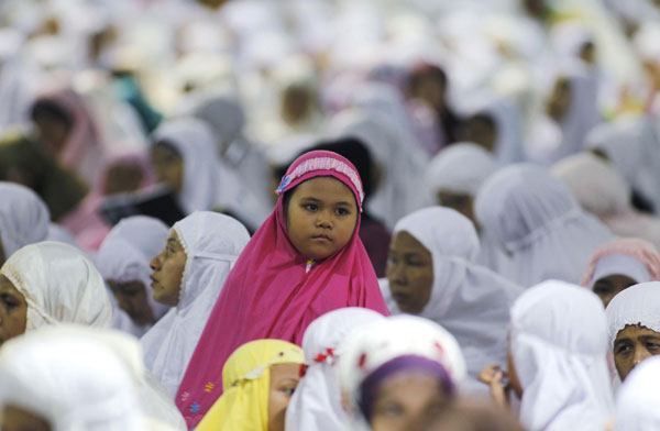 Muslims attend prayers marking the start of Ramadan