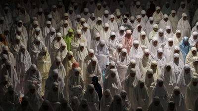 Muslims attend prayers marking the start of Ramadan