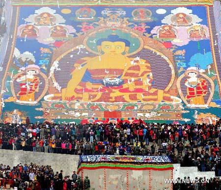 Buddha Thangka painting unfolding ceremony is held in Zhaibung Monastery on the outskirts of Lhasa, capital of southwest China's Tibet Autonomous Region, on Aug. 10, 2010. 