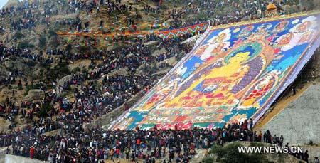 Buddha Thangka painting unfolding ceremony is held in Zhaibung Monastery on the outskirts of Lhasa, capital of southwest China's Tibet Autonomous Region, on Aug. 10, 2010.