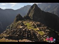 Machu Picchu is situated on a mountain ridge above the Urubamba Valley in Peru, which is 80 kilometres (50 mi) northwest of Cuzco and through which the Urubamba River flows. Most archaeologists believe that Machu Picchu was built as an estate for the Inca emperor Pachacuti (1438–1472). Often referred to as 'The Lost City of the Incas', it is perhaps the most familiar icon of the Inca World. [Photo by Xiaoyong]