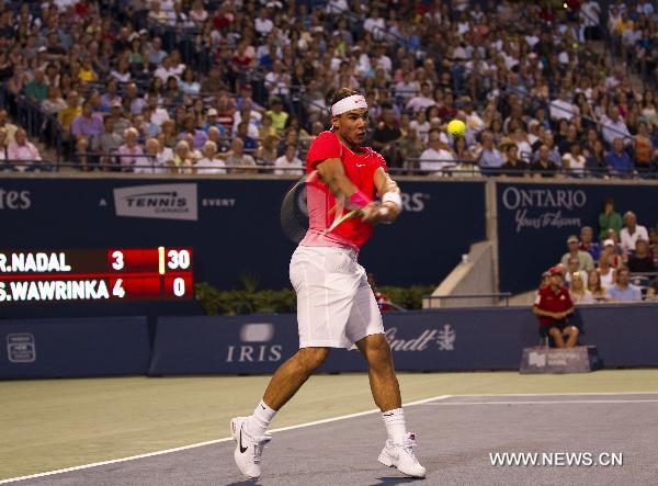 Rafael Nadal of Spain returns the ball during a match with Stanislas Wawrinka of Switzerland at the Rogers Cup in Toronto, Canada, on Aug. 11, 2010. Rafael Nadal won the match 2-0. (Xinhua/Zou Zheng)