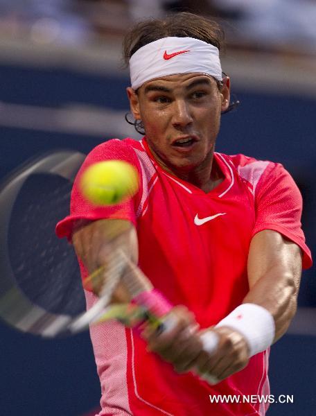 Rafael Nadal of Spain returns the ball during a match with Stanislas Wawrinka of Switzerland at the Rogers Cup in Toronto, Canada, on Aug. 11, 2010. Rafael Nadal won the match 2-0. (Xinhua/Zou Zheng)