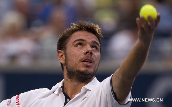 Stanislas Wawrinka of Switzerland serves during a match against Rafael Nadal of Spain at the Rogers Cup in Toronto, Canada, on Aug. 11, 2010. Rafael Nadal won the match 2-0. (Xinhua/Zou Zheng)