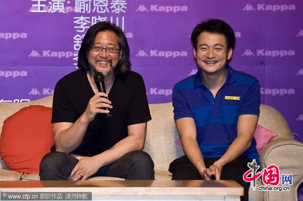 Stan Lai (left) and actor Yu Entai promote the play 'Love on a Two-Way Street' in Beijing on July 28, 2010.