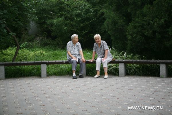 Two elderly women sit at a park in Beijing, capital of China, Aug. 13, 2010. China has 169 million citizens aged over 60, accounting for 12.5 percent of its total population. The figure would climb up to 31 percent by 2050, said Li Baoku, president of China Aging Development Foundation (CADF), on Wednesday.