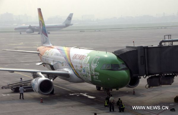 The painted plane for the World Expo waits to start its maiden flight for Kax at Hongqiao Airport in Shanghai, east China, Aug. 12, 2010. The air route between Shanghai and Kax City in northwest China's Xinjiang Uygur Autonomous Region operated by China Eastern Airlines was opened on Thursday.