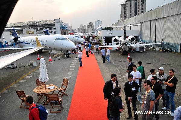 People visit the 2010 Latin American business aviation exhibition in Sao Paulo, Brazil, on Aug. 13, 2010. A total of 120 exhibitors displayed 55 aircraft in the event.
