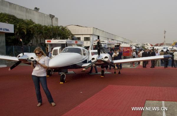 People visit the 2010 Latin American business aviation exhibition in Sao Paulo, Brazil, on Aug. 13, 2010. A total of 120 exhibitors displayed 55 aircraft in the event.