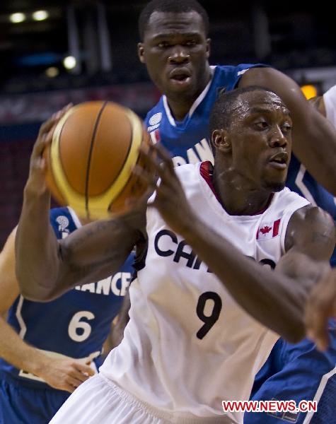 Olu Fmutimi(F) of Canada's Men's National Basketball Team competes during the exhibition game against Team France at Air Canada Center in Toronto, Canada, on Aug. 12, 2010. Team Canada won the match 69-58.