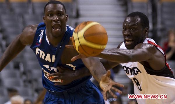 Denham Brown(R) of Canada's Men's National Basketball Team vies with Florent Pietrus of Team France during the exhibition game at Air Canada Center in Toronto, Canada, on Aug. 12, 2010. Team Canada won the match 69-58.