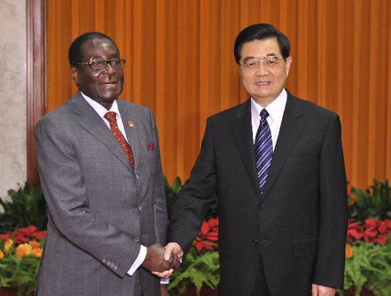 Chinese President Hu Jintao (R) shakes hands with Zimbabwean President Robert Mugabe at the Great Hall of the People in Beijing, capital of China, August 13, 2010. During their one-hour talk at the Great Hall of the People, Hu and Mugabe hailed the development of bilateral relations since the two states established diplomatic ties in 1980. [Xinhua photo]