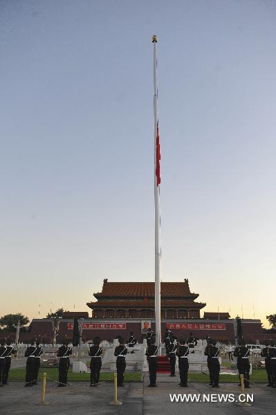 The national flag of China flies at half-mast on Tian&apos;anmen Square in Beijing, capital of China, early Aug. 15, 2010, to mourn for the victims of the mudslide disaster in Zhouqu.