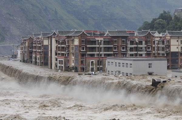 The landslide-hit Yingxiu town of Wenchuan county, Sichuan province is seen in this photo taken on August 14, 2010. No 213 national highway, a major link to Wenchuan, was blocked by the rain-triggered landslides which ravaged Wenchuan county Saturday. The landslides have also left 38 missing and forced the evacuation of over 10,000 residents.[Photo/Xinhua]
