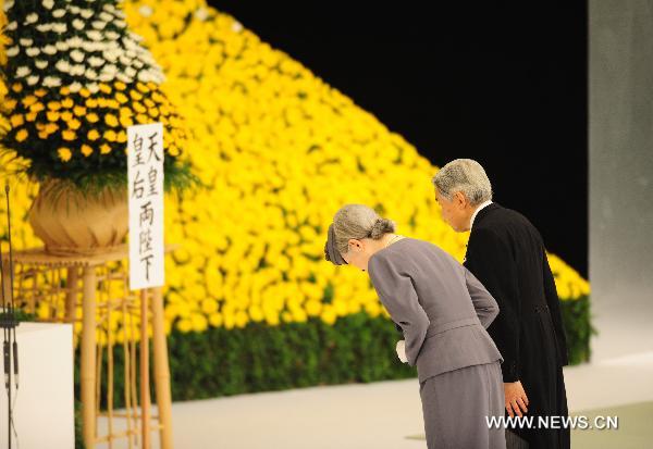 Japan&apos;s Emperor Akihito and Empress Michiko bow as they offer prayers before an alter in a memorial service for those who died in World War Two during a ceremony marking the 65th anniversary of Japan&apos;s surrender in the war, in Tokyo Aug. 15, 2010. [Xinhua]