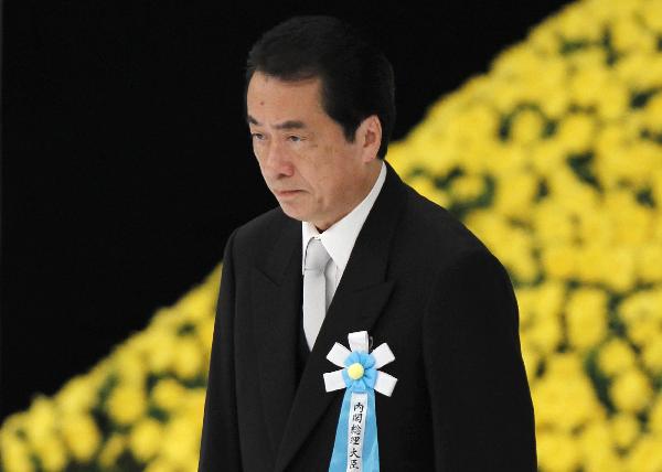 Japan&apos;s Prime Minister Naoto Kan attends a memorial service for those who died in World War Two during a ceremony marking the 65th anniversary of Japan&apos;s surrender in the war at Budokan Hall in Tokyo August 15, 2010.[Xinhua/Reuters]