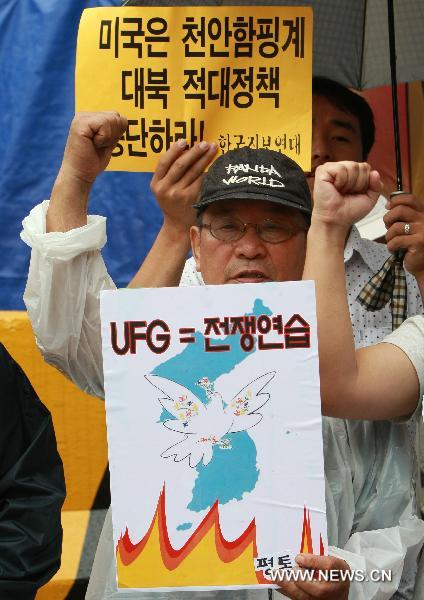 People hold a demonstration to protest against the South Korea-U.S. joint military exercise, codenamed &apos;Ulchi Freedom Guardian&apos;, in front of the South Korean-U.S. War Command Center TANGO in Seongnam, South Korea, on Aug. 16. 2010. South Korea and the U.S. began the two-week joint military exercise on Aug. 16.[Park Jin-hee/Xinhua]