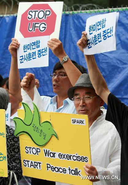 People hold a demonstration to protest against the South Korea-U.S. joint military exercise, codenamed &apos;Ulchi Freedom Guardian&apos;, in front of the South Korean-U.S. War Command Center TANGO in Seongnam, South Korea, on Aug. 16. 2010. South Korea and the U.S. began the two-week joint military exercise on Aug. 16.[Park Jin-hee/Xinhua]