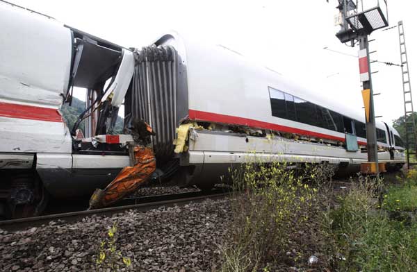 The destroyed and derailed Frankfurt-Paris InterCityExpress (ICE) highspeed train of German railway operator Deutsche Bahn AG is seen after a crash with a garbage truck in Lindenberg near Neustadt an der Weinstrasse, August 17, 2010. Nine passengers were left slightly hurt, one passenger remains seriously injured, and the truck driver escaped unharmed, police said. [Xinhua/Reuters]