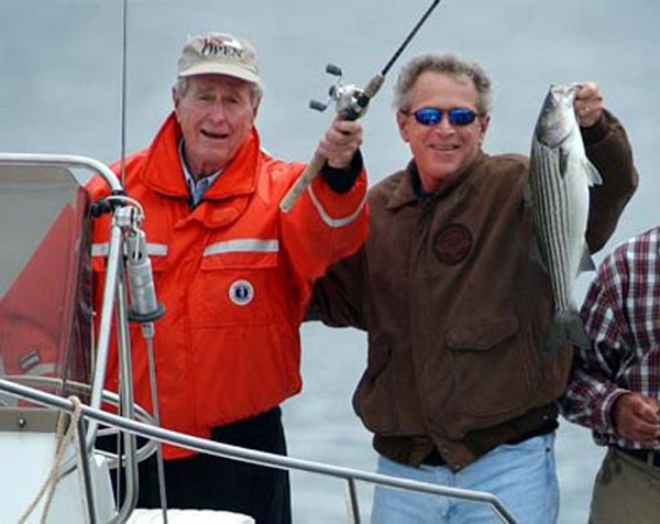 George H. W. Bush (L) and his son George W. Bush