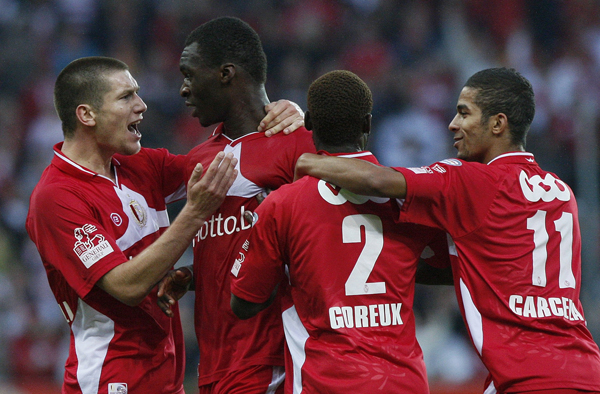 Standard Liege's Sebastien Pocognoli, Christian Benteke, Reginal Goreux and Mehdi Carcela celebrate after Benteke scored a goal during their friendly soccer match against Real Madrid in Liege August 17, 2010. (Xinhua/Reuters Photo) 