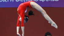 Tan Sixin of China competes during women's qualification of artistic gymnastics of the Singapore 2010 Youth Olympic Games at Bishan Sports Hall in Singapore, August 17, 2010.