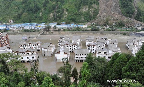 The water level of the Minjiang river, which savaged Yingxiu Township, gets lower in Wenchuan County, southwest China's Sichuan Province, Aug. 15, 2010. At 