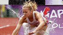 Katarzyna Dulak of Poland fell down to the water pool during the girls 2000m Steeplechase event at Bishan Stadium of the Singapore 2010 Youth Olympic Games in Singapore, August 18, 2010.