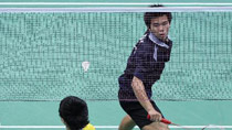 Pisit Poodchalat of Thailand returns the shuttlecock against Malaysia's Loh Wei Sheng during the boys' singles semifinal of badminton at the Singapore 2010 Youth Olympic Games in Singapore, August 18, 2010. Pisit Poodchalat won the match 2-1.