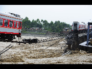 The damaged passenger train and railway are seen in this photo taken on August 19, 2010.[Xinhua]