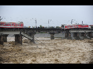 The damaged passenger train and railway are seen in this photo taken on August 19, 2010.[Xinhua]