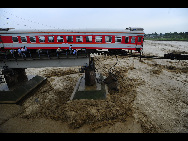 The damaged passenger train and railway are seen in this photo taken on August 19, 2010.[Xinhua]