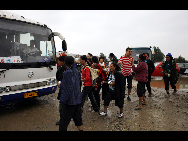 Two carriages of a passenger train fell into a river after floods destroyed a bridge in Guanghan, Sichuan province, August 19, 2010. All the passengers were evacuated and no casualties have been reported so far.[Xinhua]