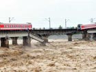 Train falls into river after bridge collapses