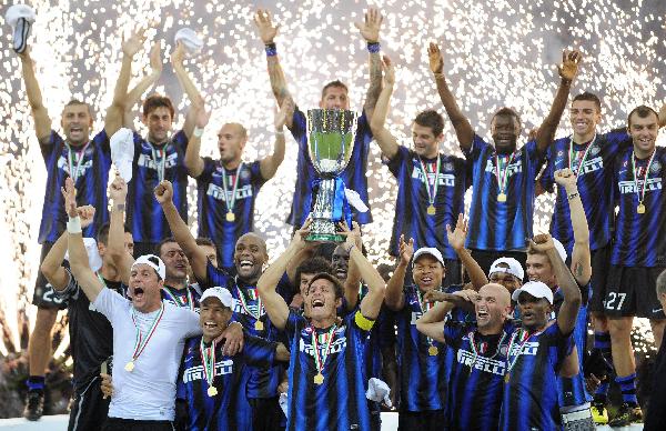 Inter Milan's Javier Zanetti holds the trophy after winning the Italian Super Cup soccer match against AS Roma at the San Siro Stadium in Milan, northern Italy August 21, 2010. Inter Milan won their fourth trophy of the year as they added the Italian Supercup to their Champions League, Serie A and Italian Cup triumphs with a 3-1 win over AS Roma on Saturday. 