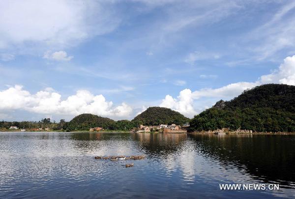 Photo taken on Aug. 20, 2010 shows the lake in Yanshan County of Zhuang-Miao Autonomous Prefecture of Wenshan, southwest China's Yunnan Province. [Xinhua/Yang Zongyou]