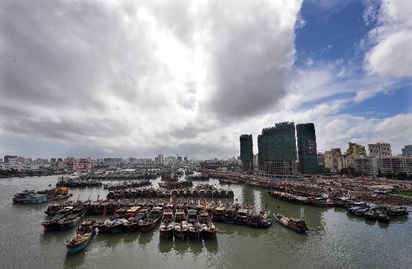 Fishing boats dock at a harbor in Haikou, south China's Hainan Province, on Aug. 23, 2010. The fifth tropical storm of the year is expected to arrive in Hainan Monday night or Tuesday, the local weather bureau reported. 
