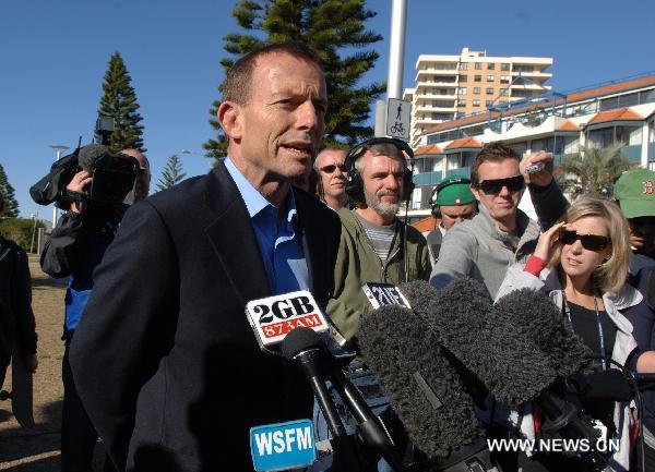 Australia's opposition leader Tony Abbott is interviewed at his electorate in Sydney on August 21, 2010. Polls opened Saturday morning for Australia's federal elections for the 43rd Parliament amidst a poll-suggestion that Prime Minister Julia Gillard led Labor Party is running neck-and-neck with Tony Abbott led Coalition. [Jiang Yaping/Xinhua]